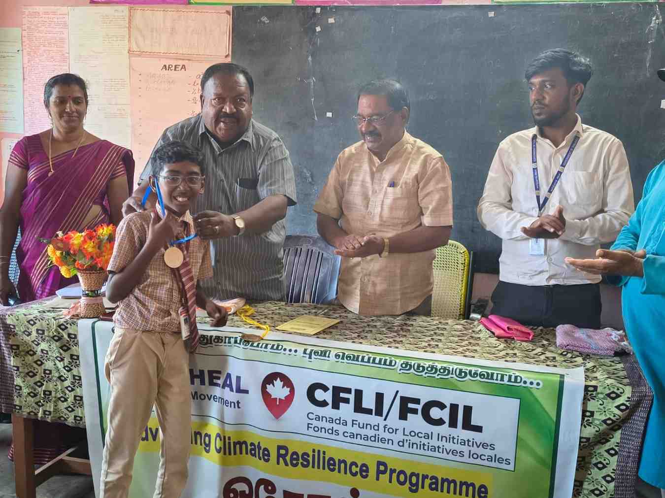 Youth and community members in a coastal plastic clean-up drive